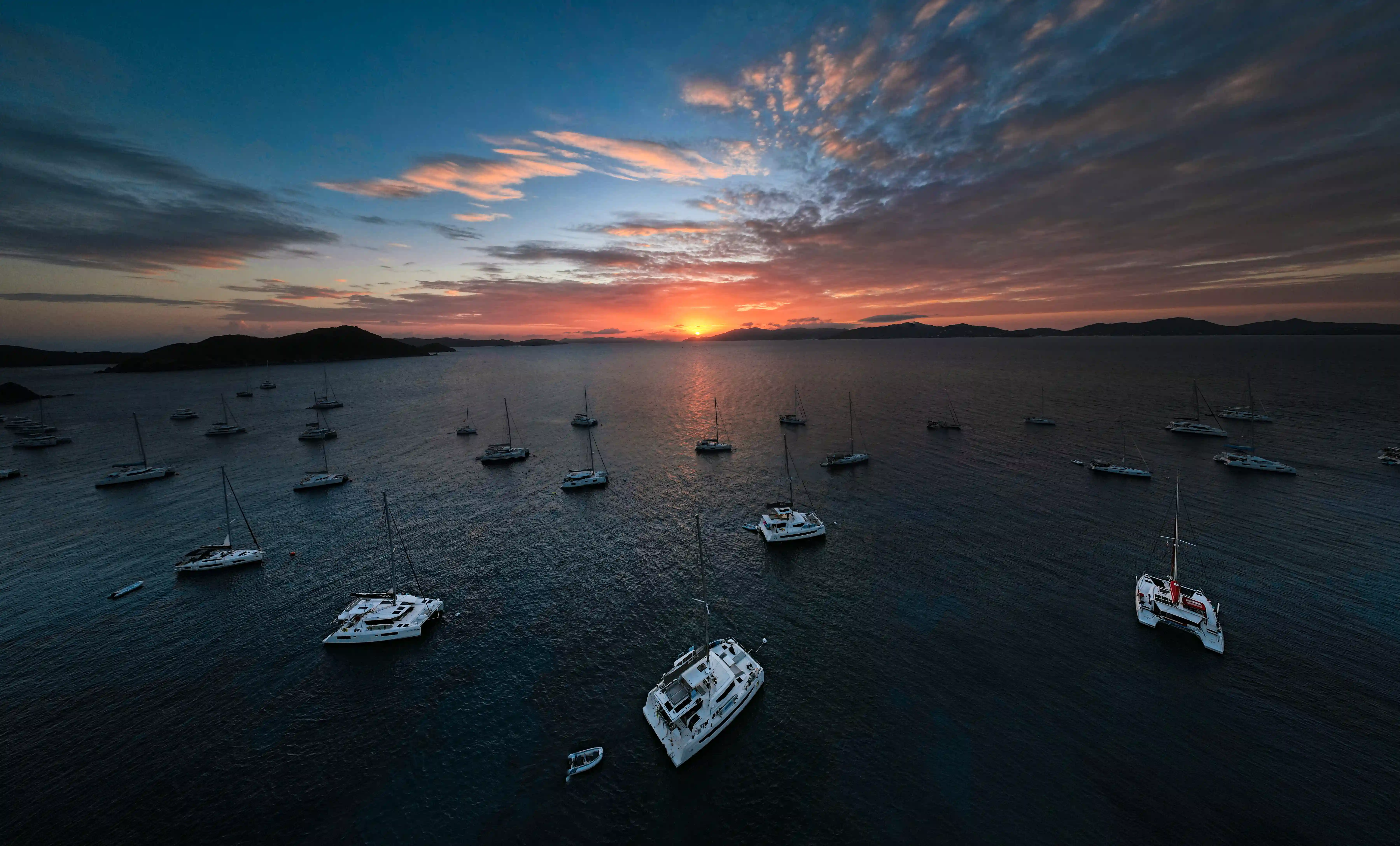 Panoramic aerial view of catamarans at sunset