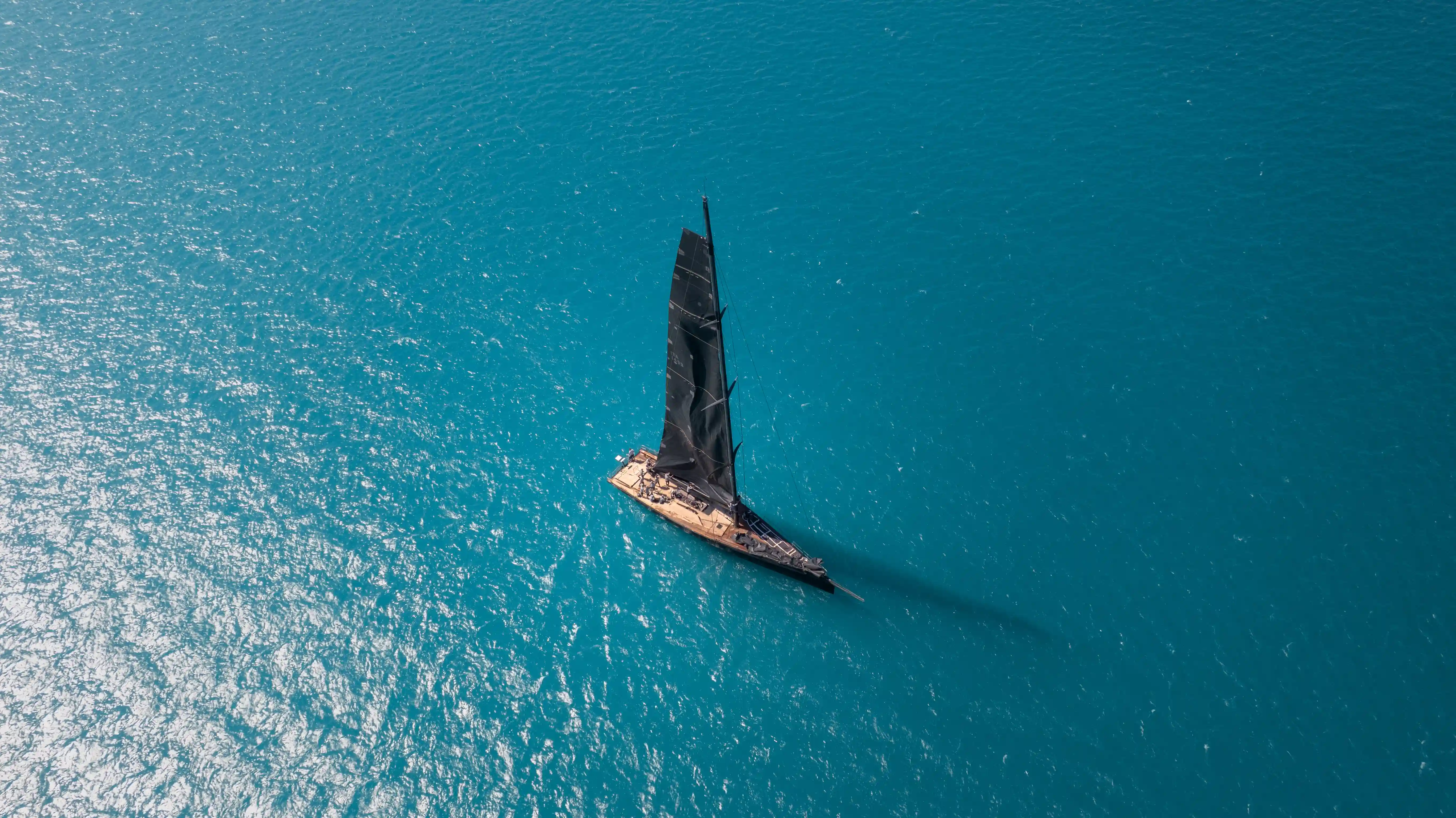 Aerial view of the winning sailboat at a regatta